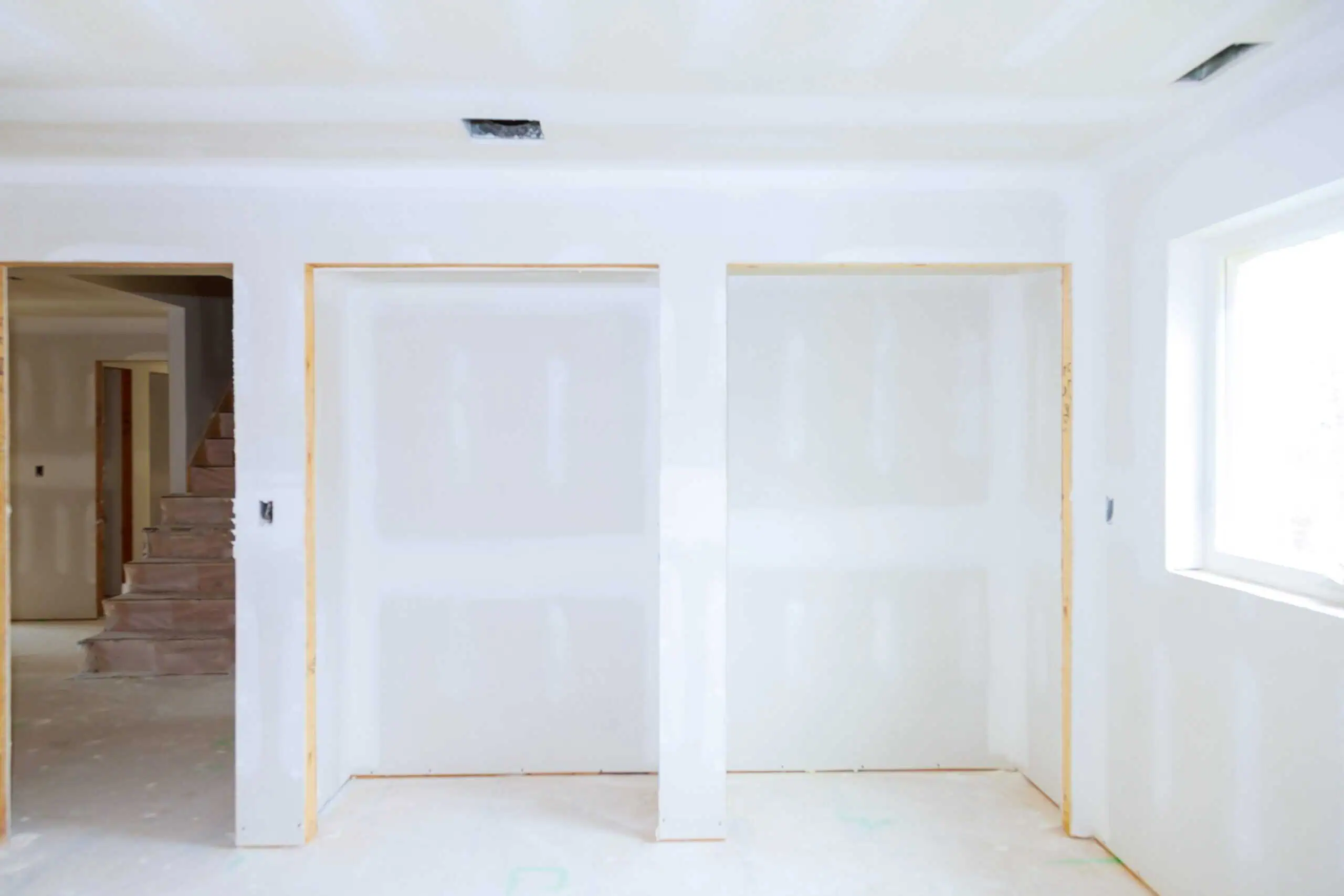 Drywall installation in a new home interior by Enriquez Drywall INC.