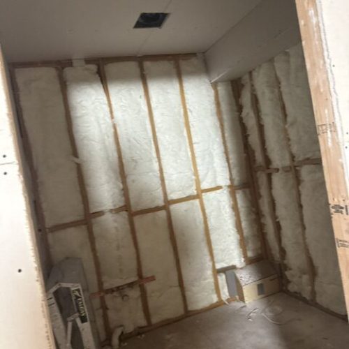 Drywall installation in progress for interior wall renovation by Enriquez Drywall INC.
